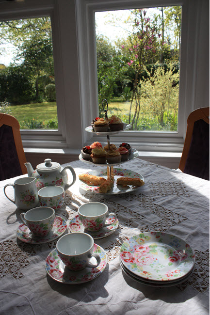 afternoon tea set in front of a window