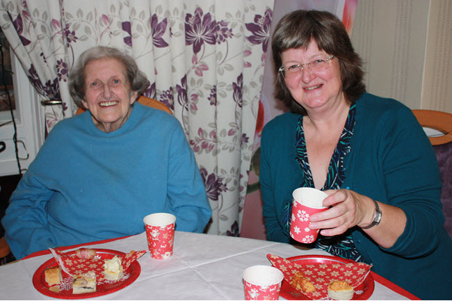 women enjoying a meal at a care home