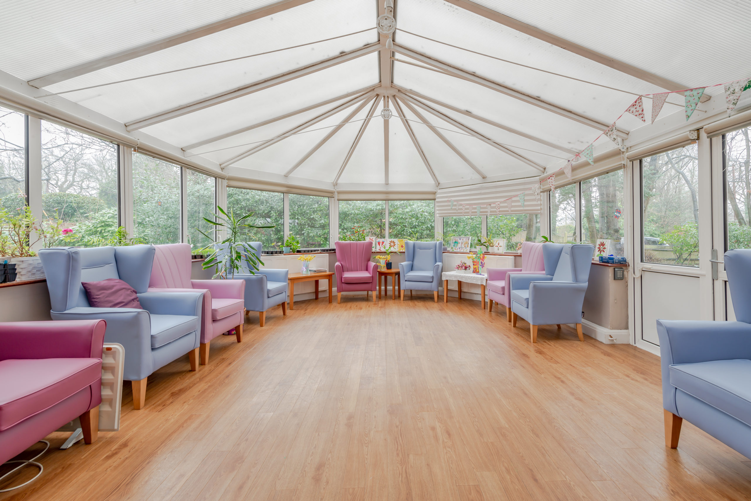 large care home conservatory with multiple chairs