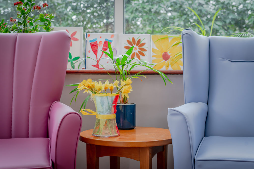 daffodils sat by a windowsill in a care home