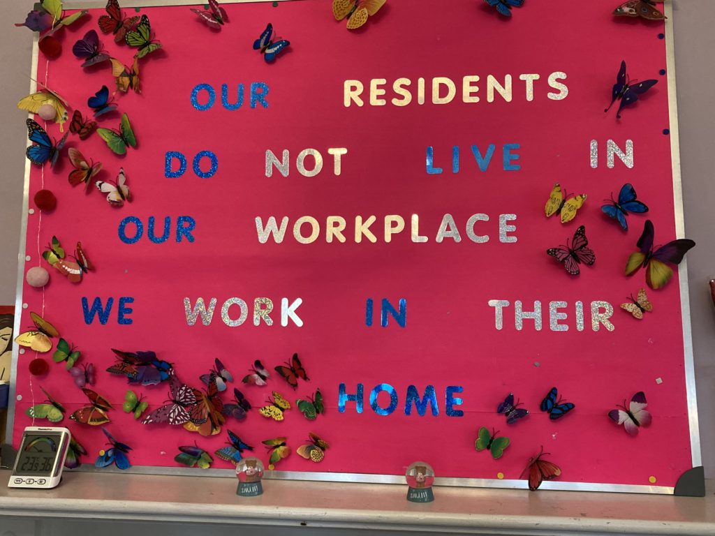 writing on a wall that says "our residents do not live in our workplace, we work in their home