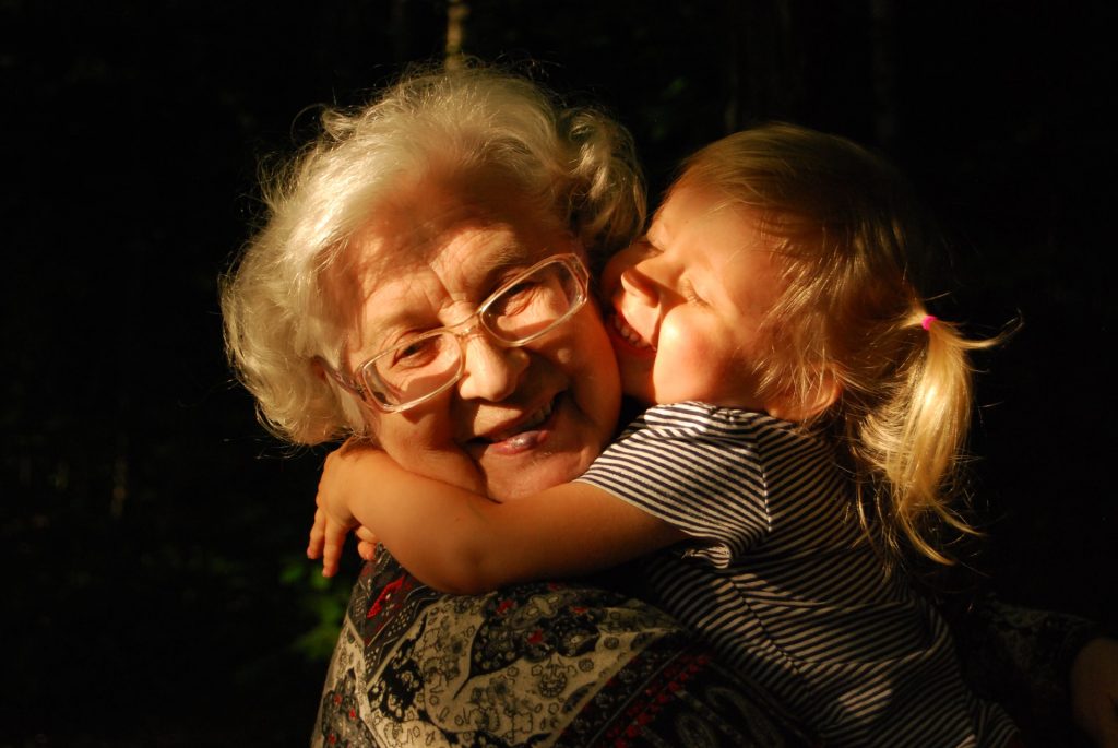 grandmother holding a toddler
